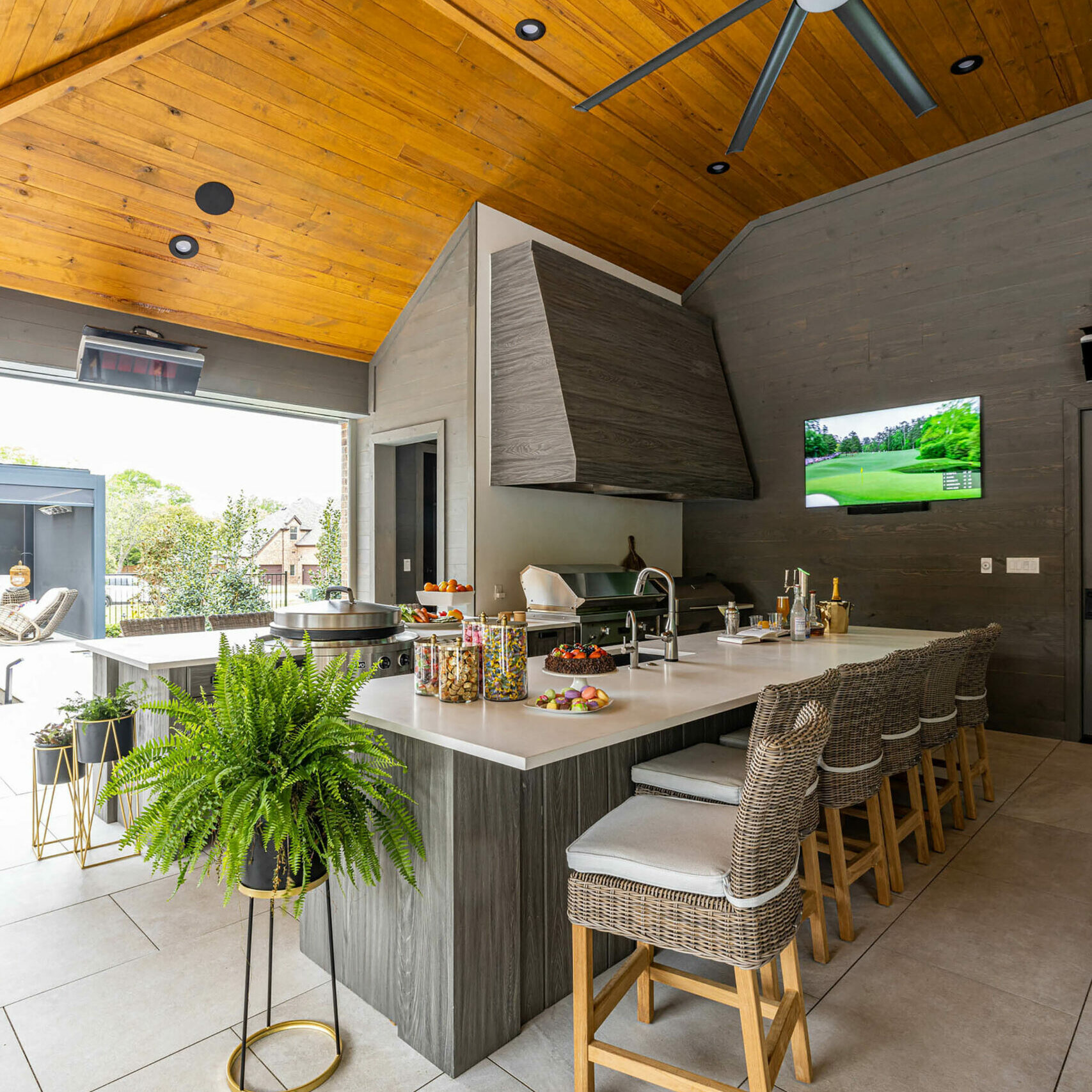 Birkenfeld_Pool cabana full kitchen with custom hood and four grills and custom ceiling fan and custom cabinetry in Keller Texas